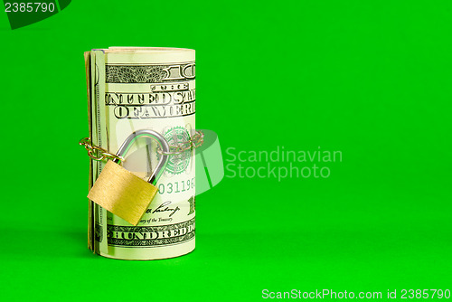 Image of Roll of US dollars chained and locked