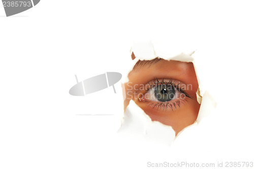 Image of Girl looking through a hole in paper