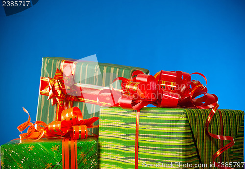 Image of Christmas presents against blue background