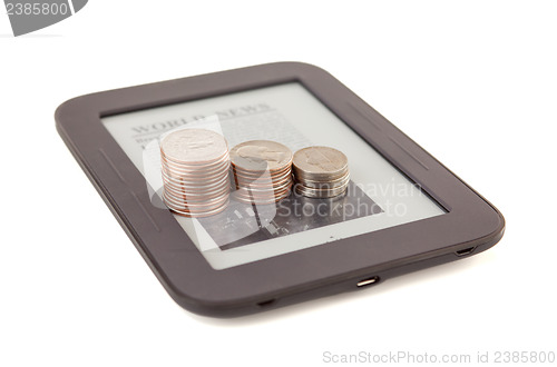 Image of Electronic book reader with bars of coins