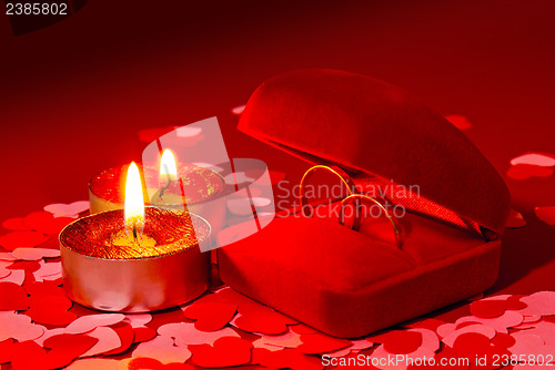 Image of Two rings in a box and two candles