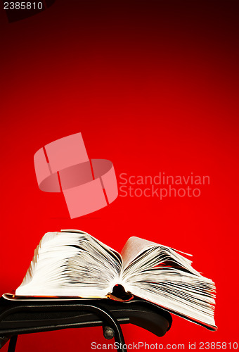 Image of Open book laying on the chair