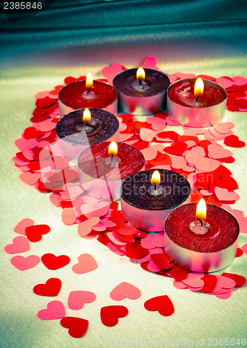 Image of Burning candles heart shaped 