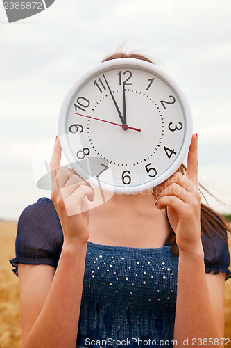 Image of Female holds watches