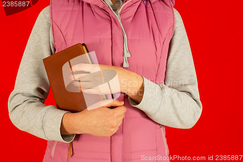 Image of Female staying with a book