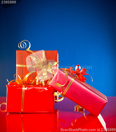 Image of Christmas presents against blue background