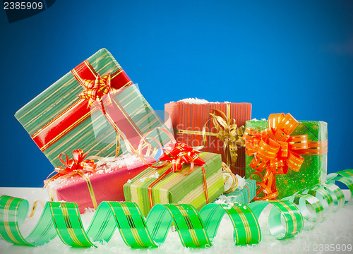 Image of Christmas presents against blue background