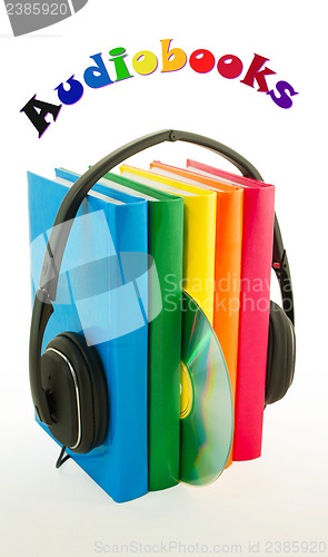 Image of Row of books and headphones - Audiobooks concept