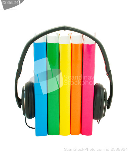 Image of Row of books and headphones - Audiobooks concept