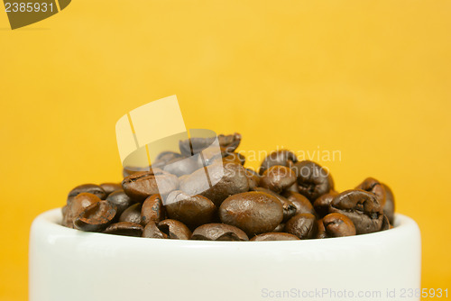 Image of Cup full with coffee beans