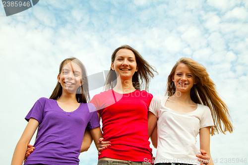 Image of Three teen cheerful girls