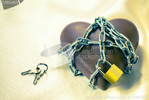 Image of Heart shaped chocolate tied up with chains