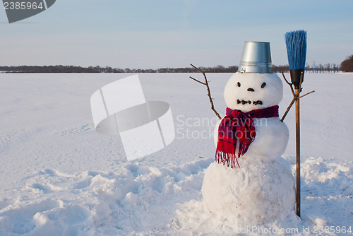 Image of Lonely snowman at a snowy field