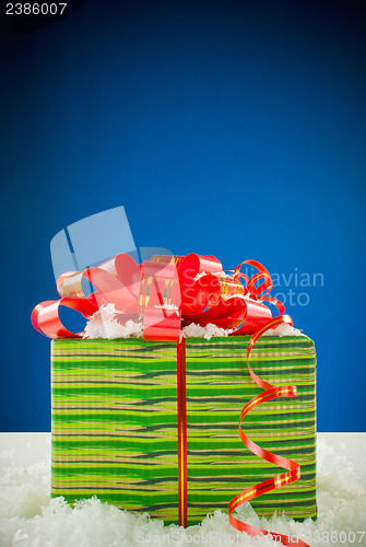 Image of Christmas present against blue background