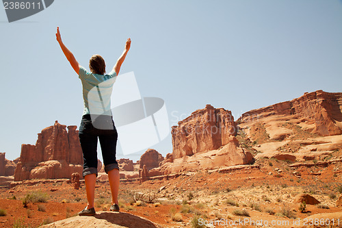 Image of Woman with raised hands