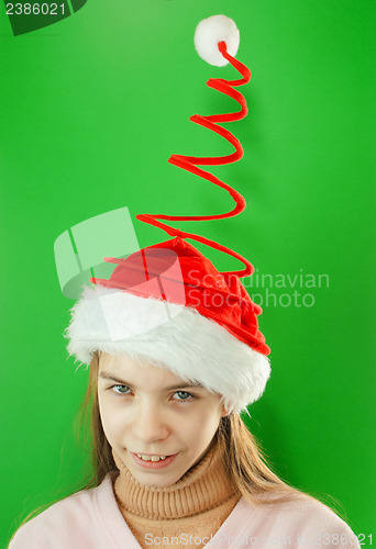 Image of Pretty Santa girl, closeup portrait of a teen girl wearing Chris