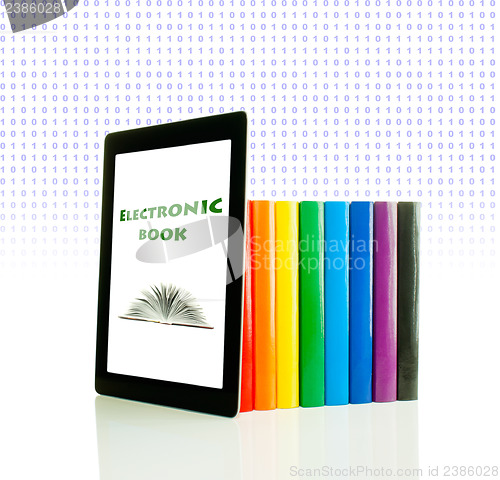 Image of Row of colorful books and tablet PC over white background