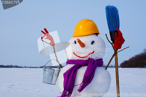 Image of Lonely snowman at a snowy field