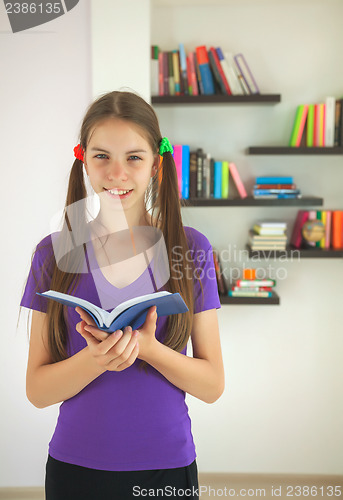 Image of Teenage girl with a book