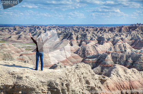 Image of Woman with raised hands