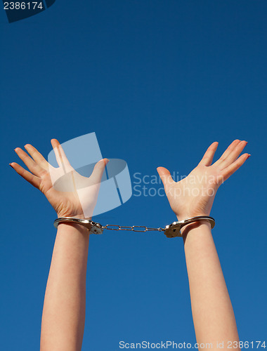 Image of Handcuffed woman's hands