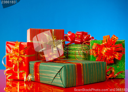 Image of Christmas presents against blue background