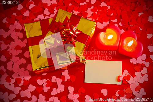 Image of Presents and two heart shaped candles with blank card