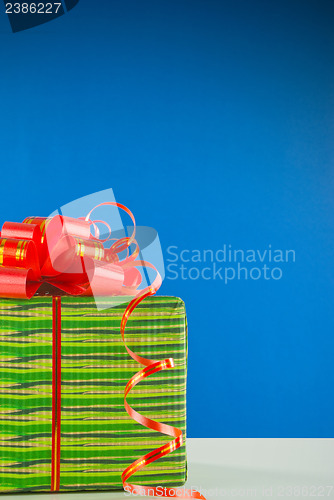 Image of Christmas present against blue background