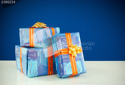 Image of Christmas presents against blue background