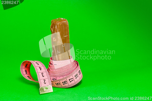 Image of Chocolate bar with a pink metering tape