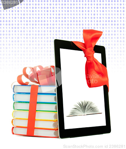 Image of Books tied up with ribbon and tablet PC against white background