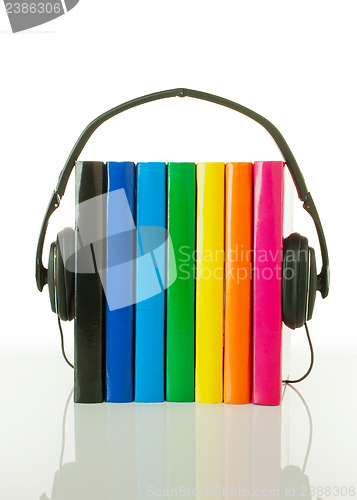 Image of Row of books and headphones - Audiobooks concept