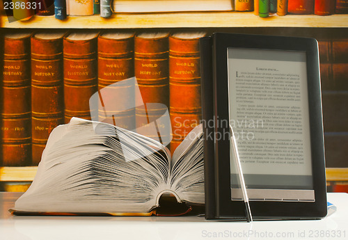 Image of Open book and electronic book reader