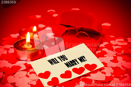 Image of Card with marriage proposal and two rings and two candles