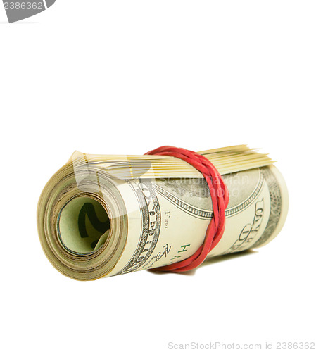 Image of Roll of US dollars tied up with rubber