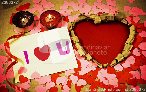 Image of St. Valentine's day greeting background with two burning candles