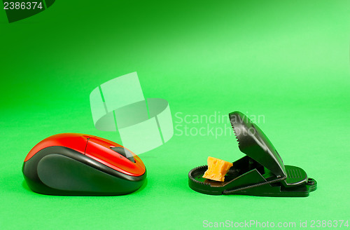 Image of Computer mouse with a mousetrap