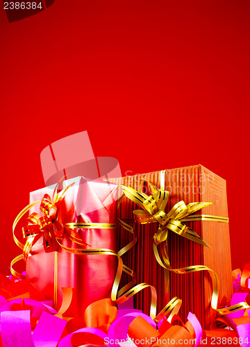 Image of Presents in red boxes against red background