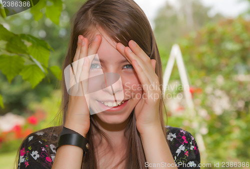 Image of Teen girl staying outdoors