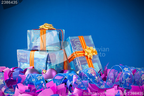 Image of Christmas presents against blue background