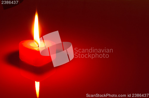 Image of Burning heart shaped candle