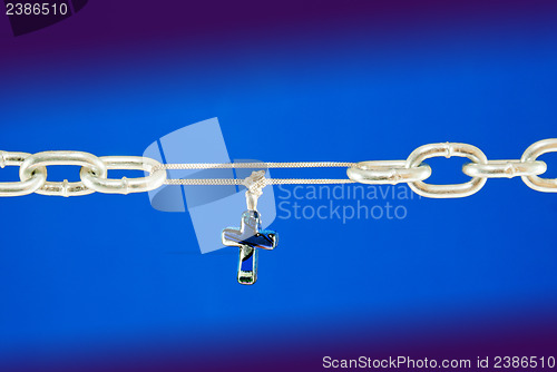 Image of Broken chain connected with a cross