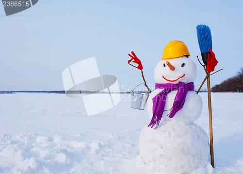 Image of Lonely snowman at a snowy field