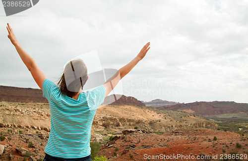 Image of Woman with raised hands