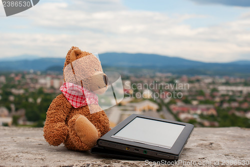 Image of Electronic book reader laying outdoors