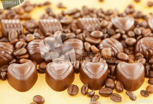 Image of Heart shaped chocolate candies and coffee beans