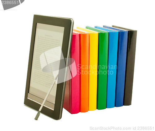 Image of Stack of colorful books and electronic book reader