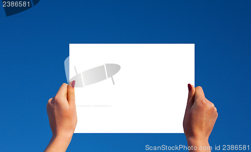 Image of Hands holding a frame with clouds