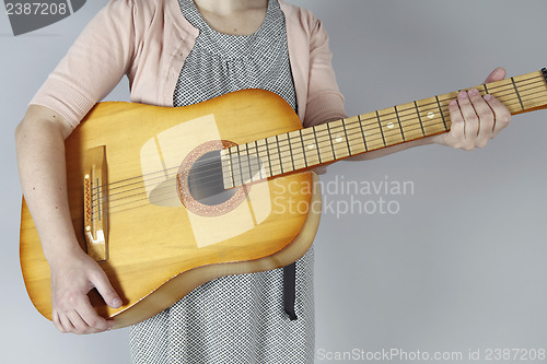 Image of Playing the guitar