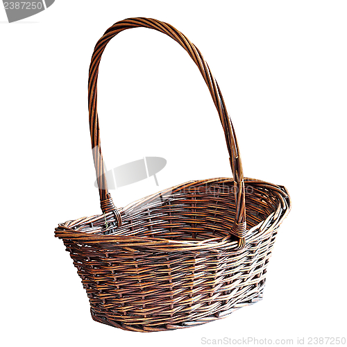Image of brown wooden basket over white